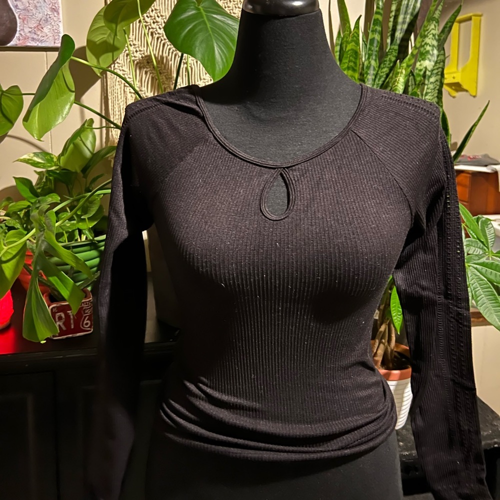 Black tight Hollister shirt with holes in arms. Size medium